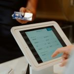 A modern cashless payment system using a tablet and card for seamless transactions.